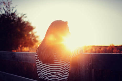 Silhouette of woman at sunset