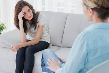 Counseling session with therapist and client